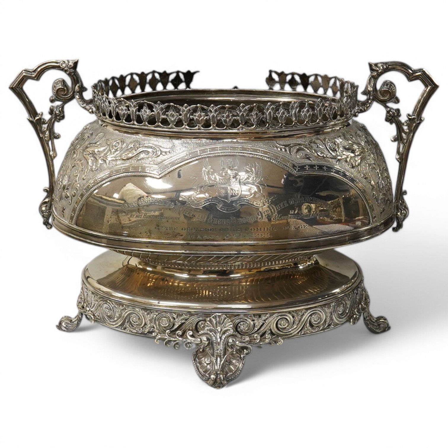 A large impressive late Victorian embossed silver presentation two handled oval jardiniere, by John Newton Mappin, London, 1894, with engraved armorial and presentation inscription to 'William Angus Drogo, 9th Duke of Ma